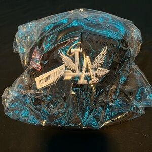 Black LA baseball cap with patch on the side.